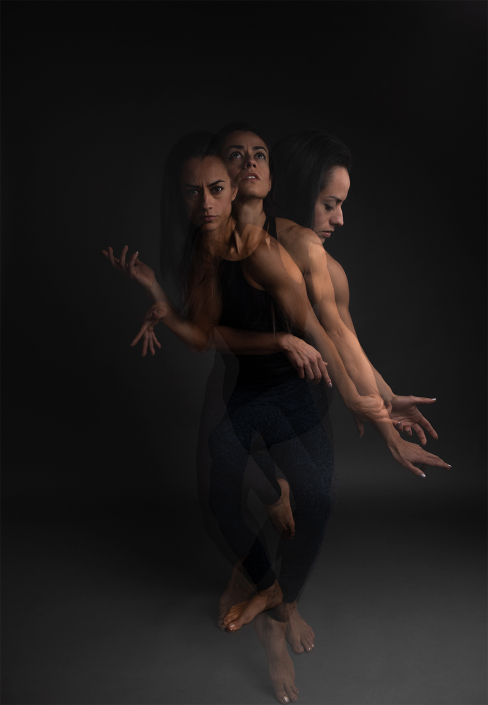 Triple exposure of a female athlete gracefully performing a cat flow, showcasing fluid motion and strength.