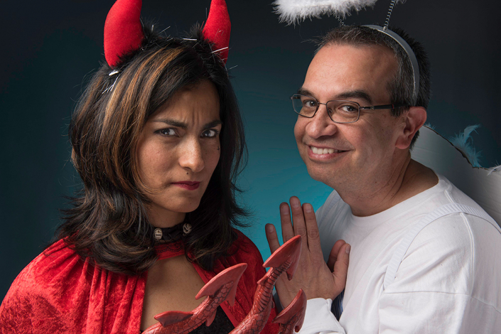 Whimsical couple ready to party: Dressed in creative angel and devil costumes, radiating playful energy and ready for a memorable night.