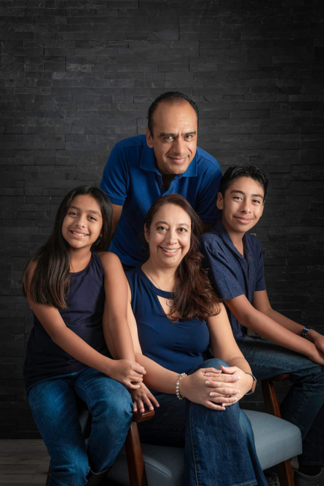 Captivating in-studio portrait of a close-knit Latin family, radiating warmth and unity.