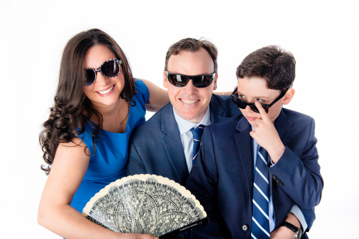 Fashionable family sporting dark glasses in a chic and composed in-studio portrait in Burlington, Ontario