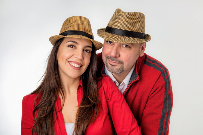 Emotionally connected couple portrayed in a studio setting, radiating affection and closeness.